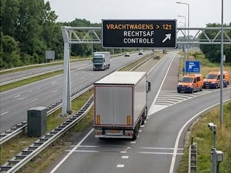 Overhead sign directing heavy goods vehicles to a roadside inspection area
